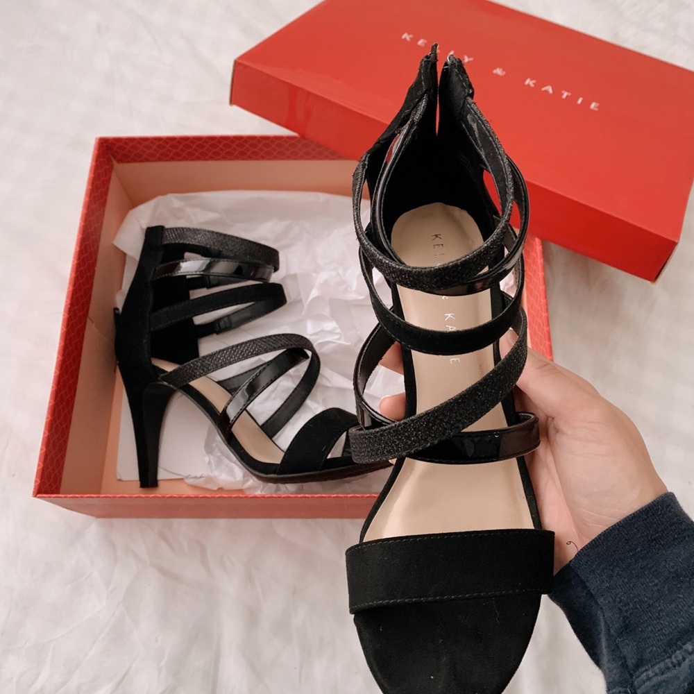 Black strappy heels, size 7.5 and gently worn!